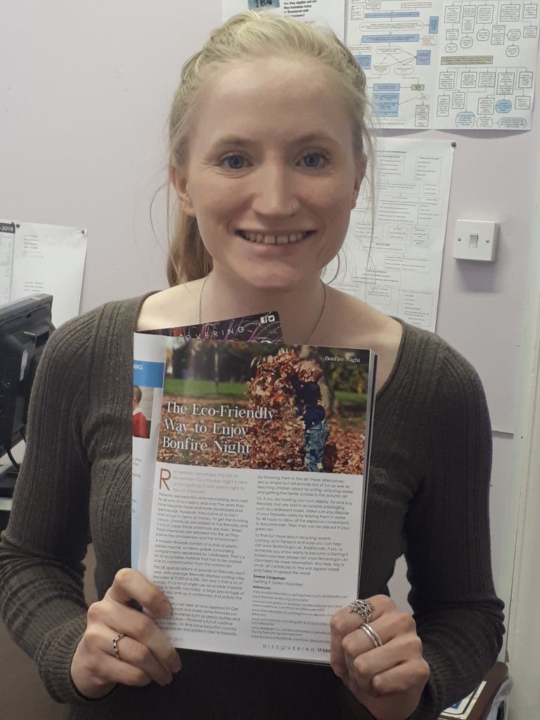 Emma showing off her article in the local paper